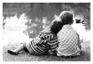 kids cuddled by the water Pictures, Images and Photos